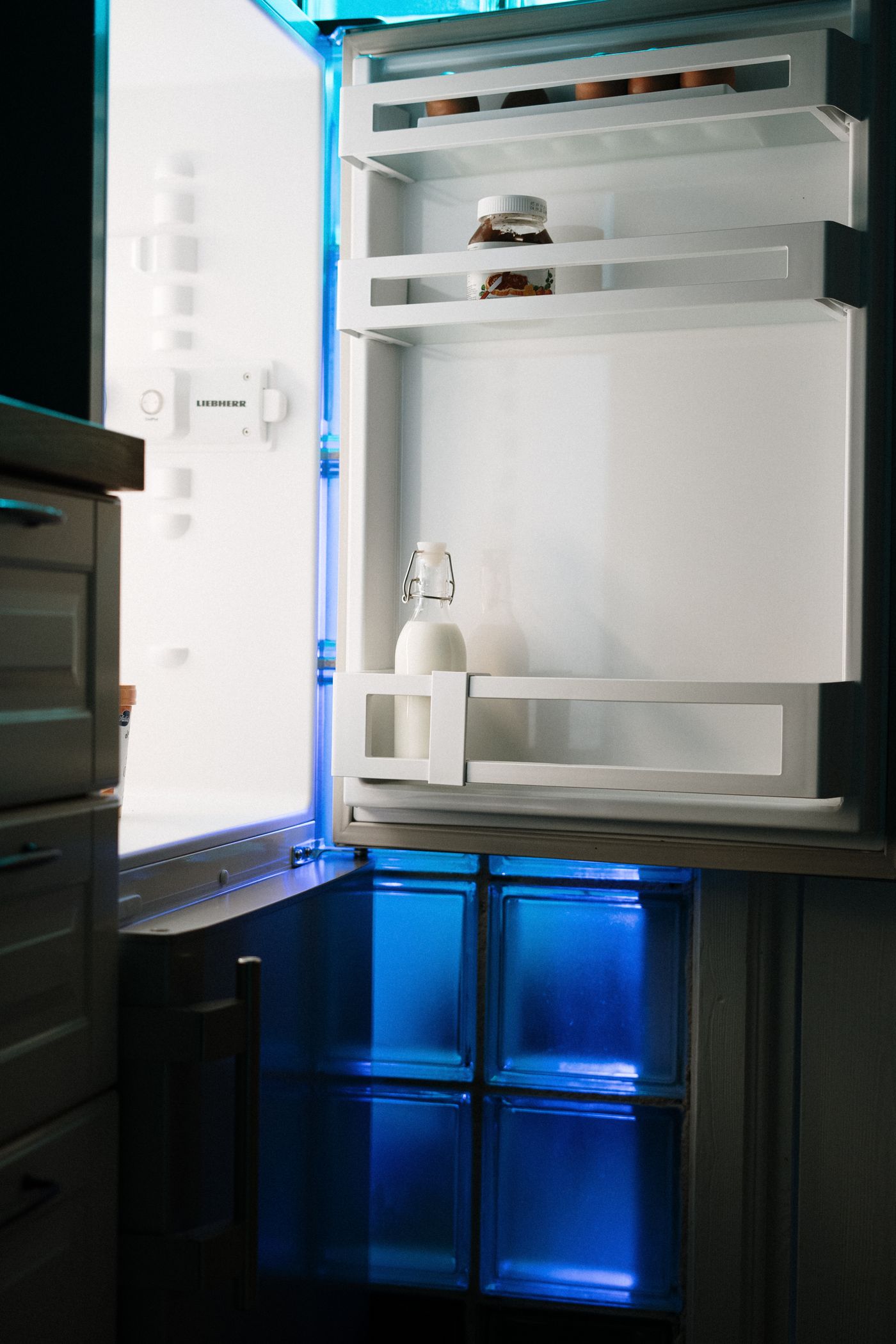 Open fridge with visible empty shelf space