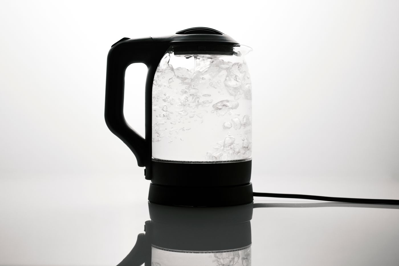 Glass kettle with visible water