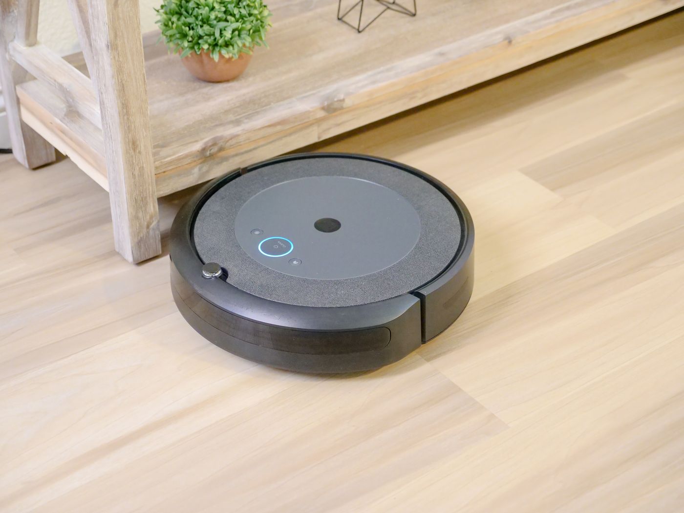 Robot vacuum cleaner on wooden floor