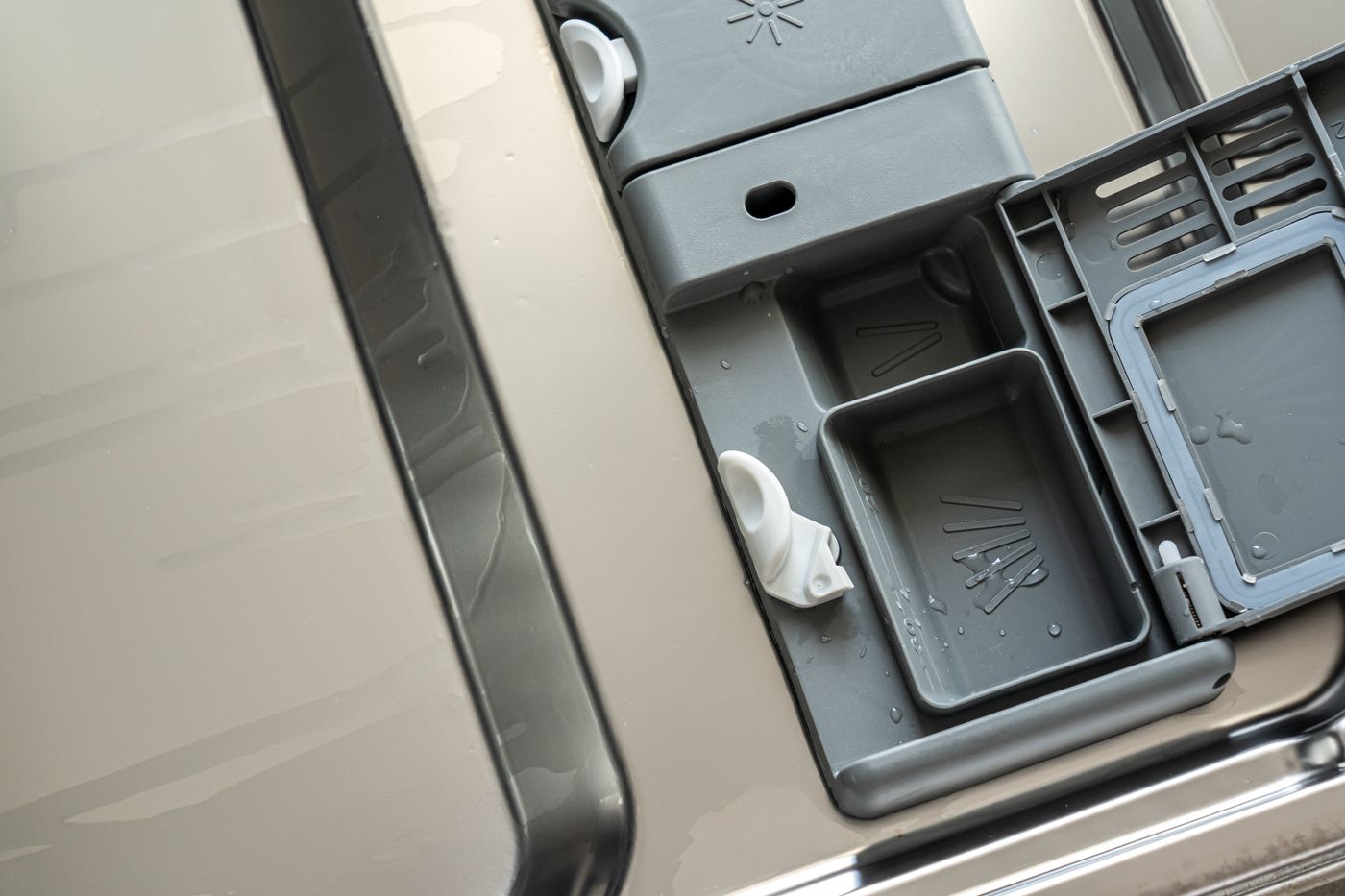 Open dishwasher detergent compartment