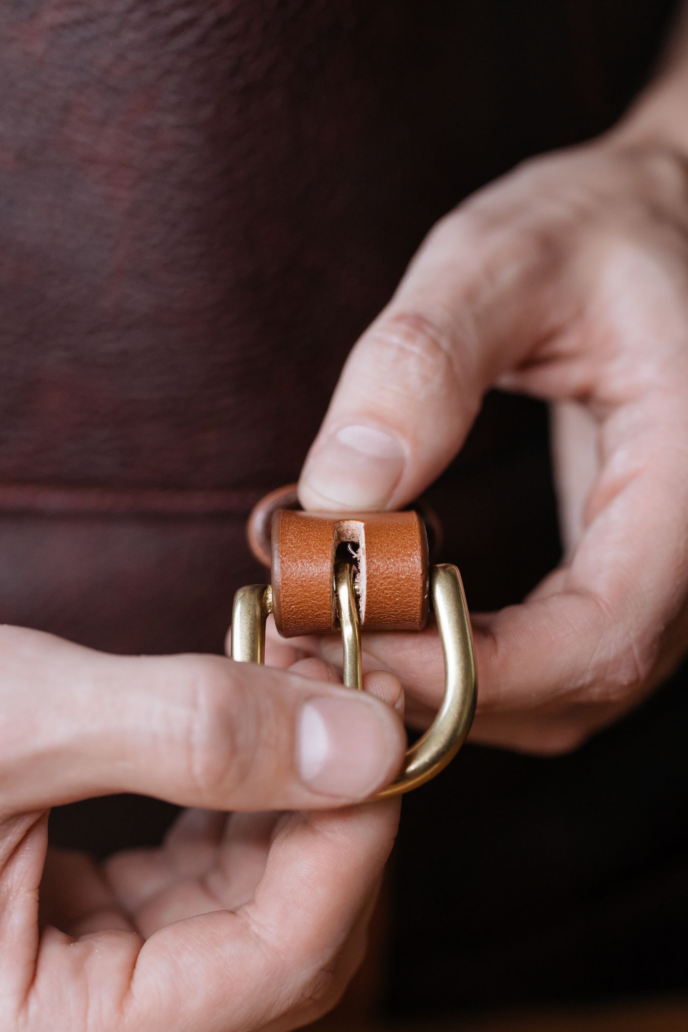 Adjusting a leather belt buckle